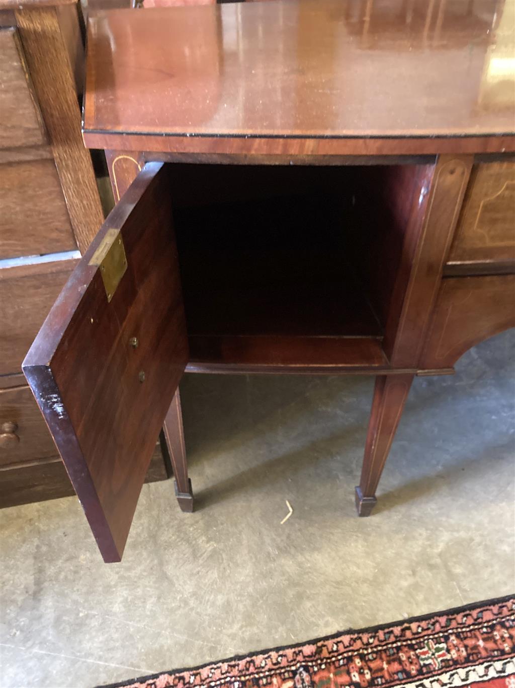 An Edwardian George III style mahogany and satinwood banded bow front sideboard, length 168cm, depth 66cm, height 92cm